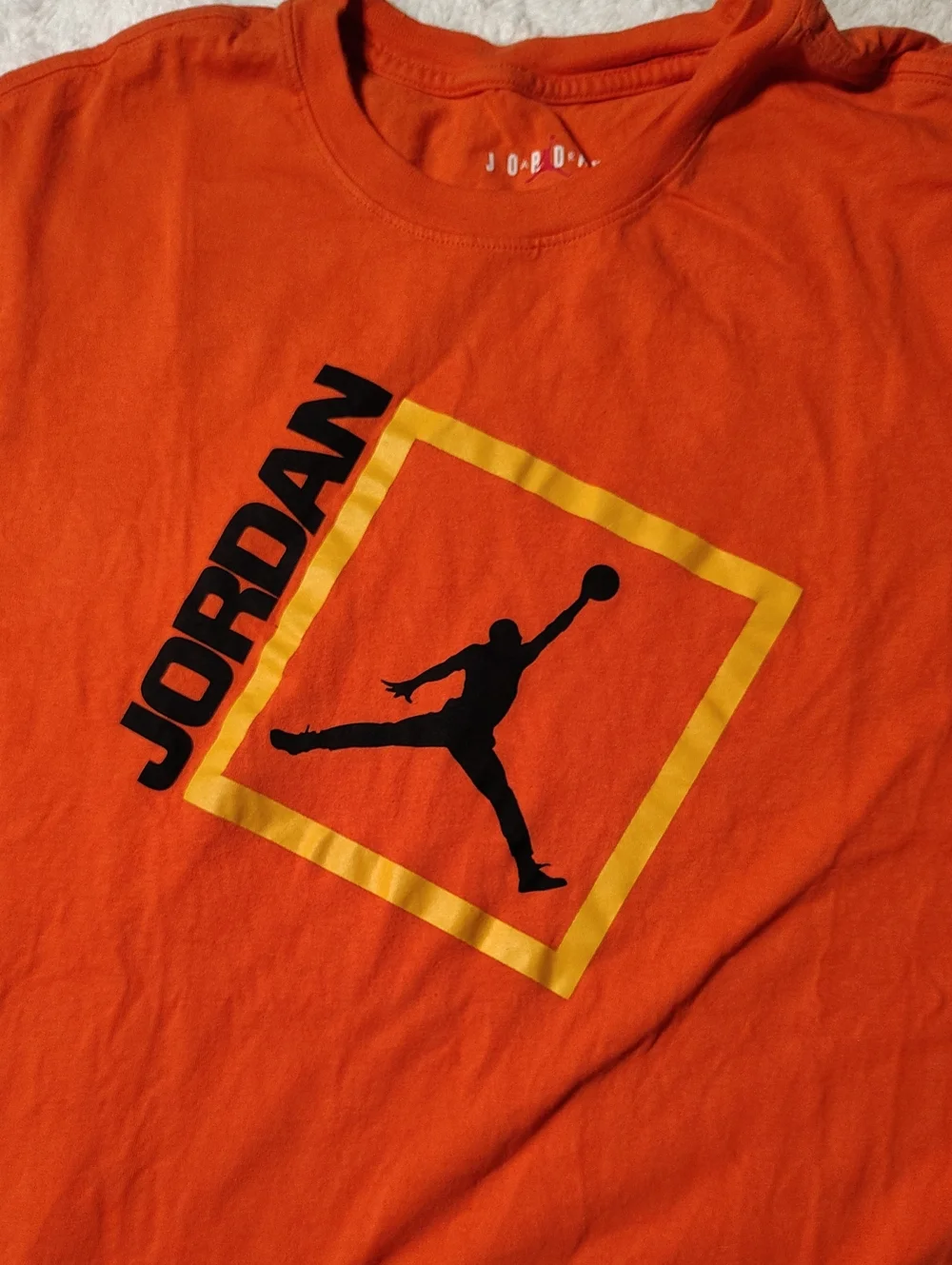 Jordan Orange Short Sleeve Tee with Black Jumpman and Yellow Frame